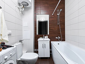 cuarto de baño con azulejos marrones y blancos